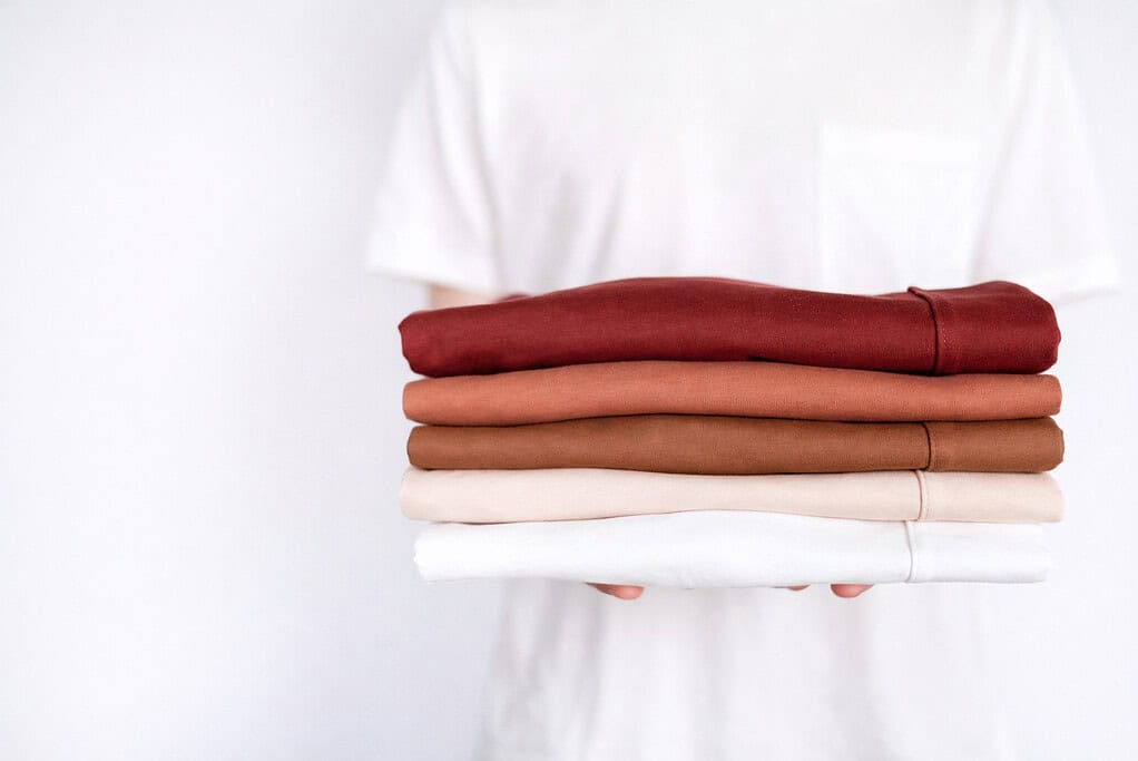 a different kind of clothes held by a person