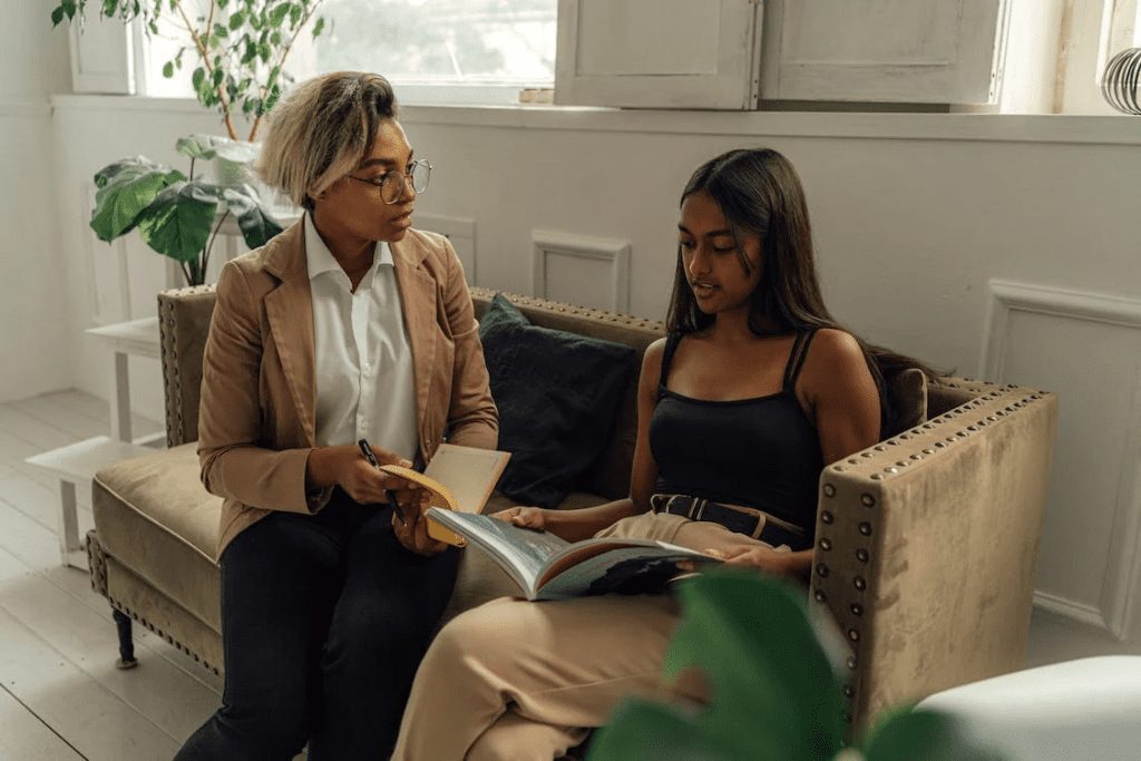 A professor talking to her student