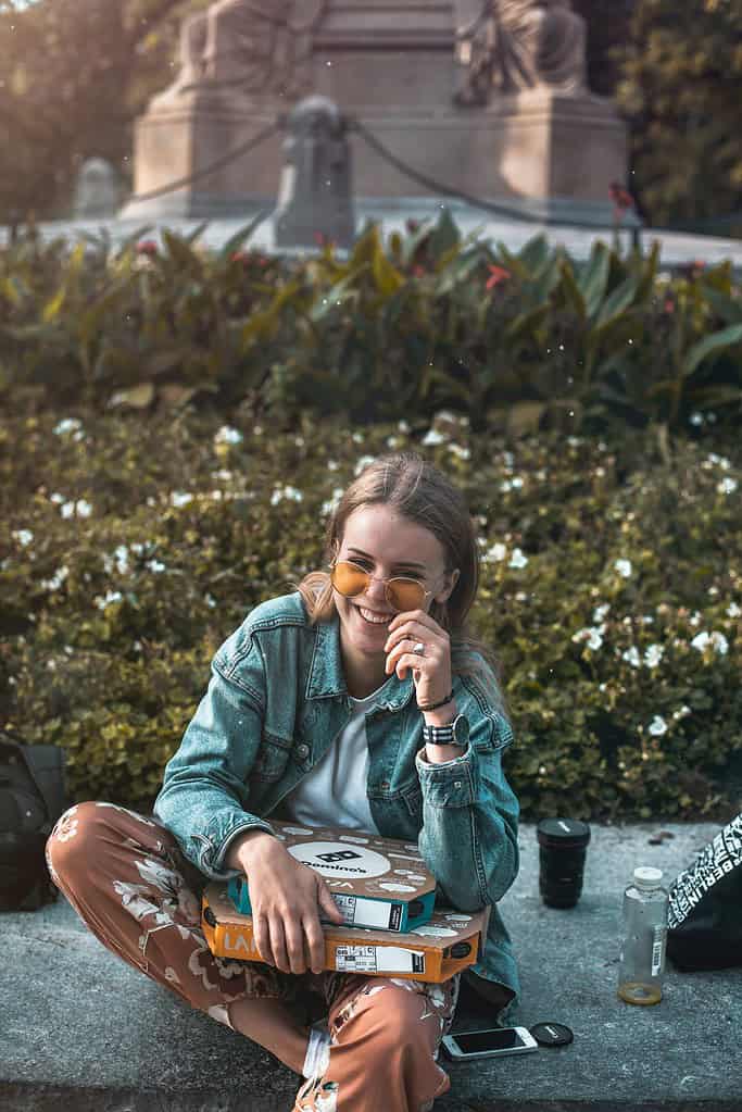 a woman smiling while sitting