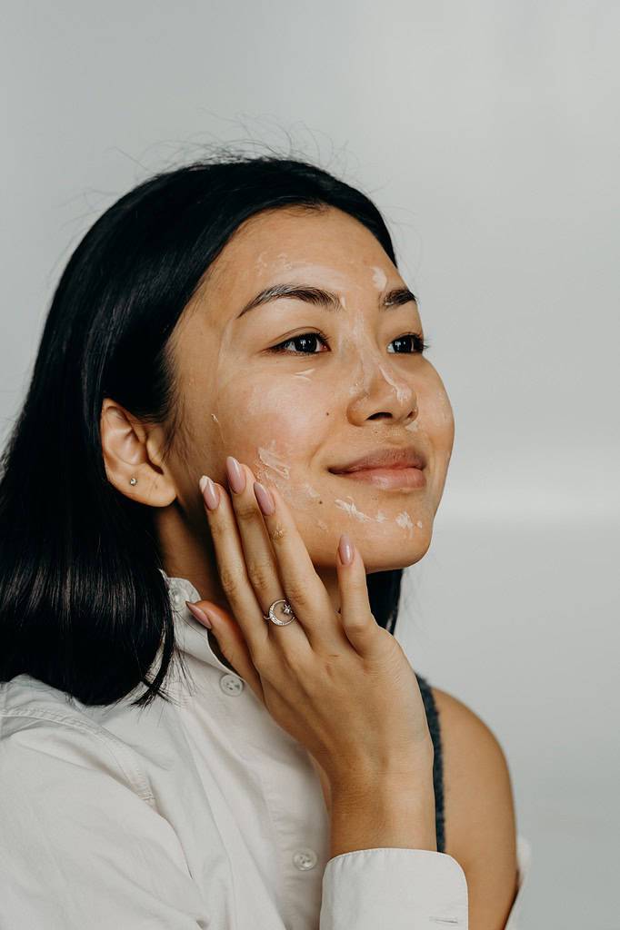 a woman doing a skincare routine