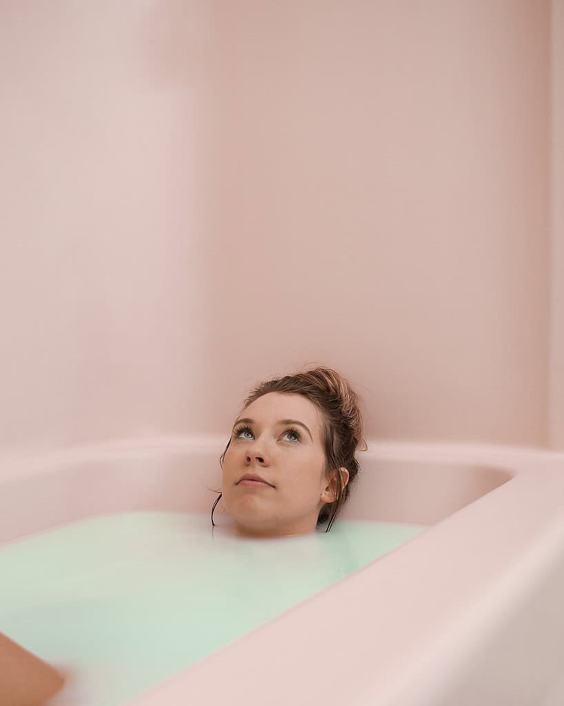 a woman into the bathtub