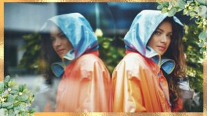 A woman age 30 with stunning photo of her outfit reflecting the glass