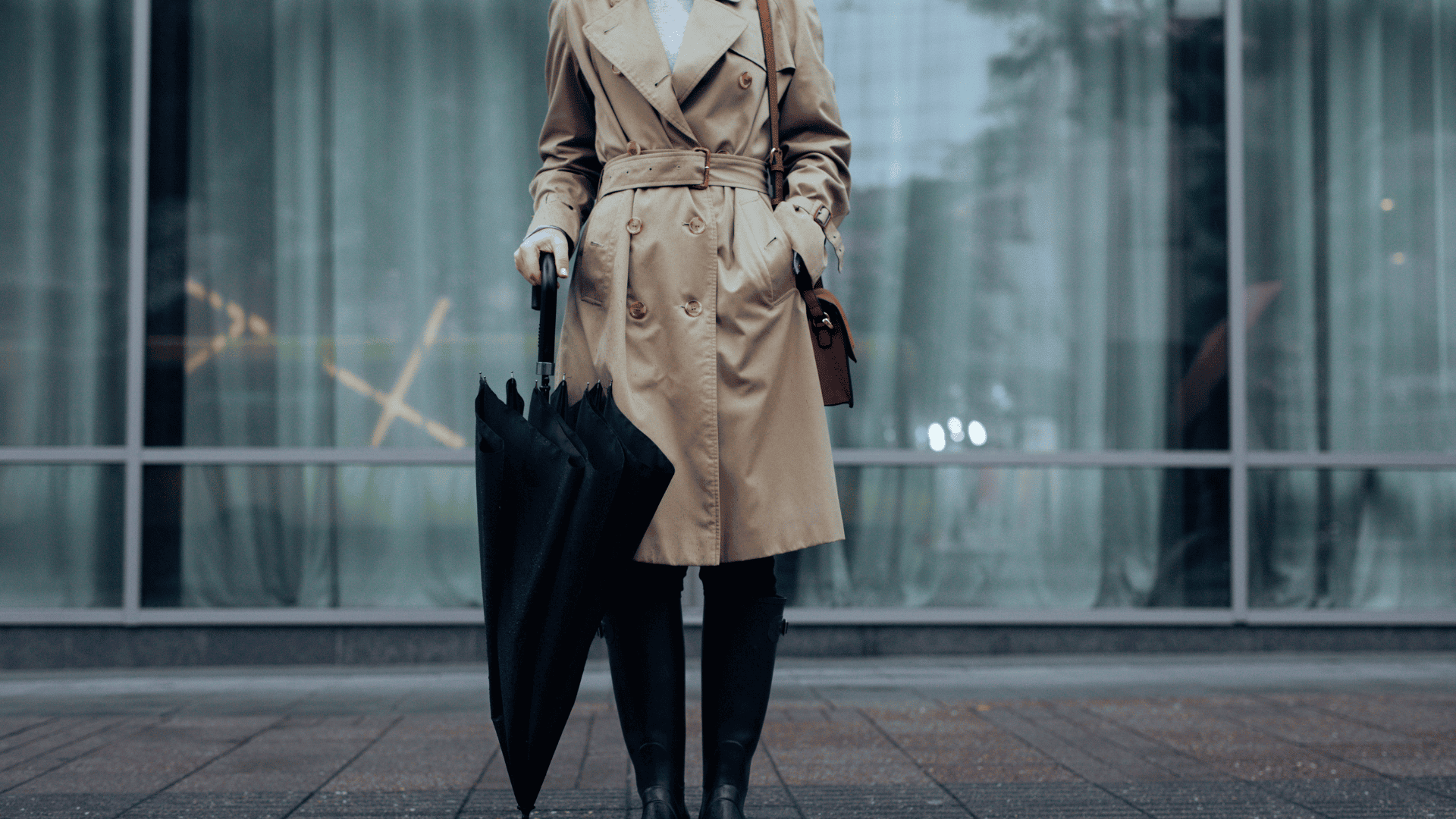 A Woman in Trench Coat Holding Umbrella