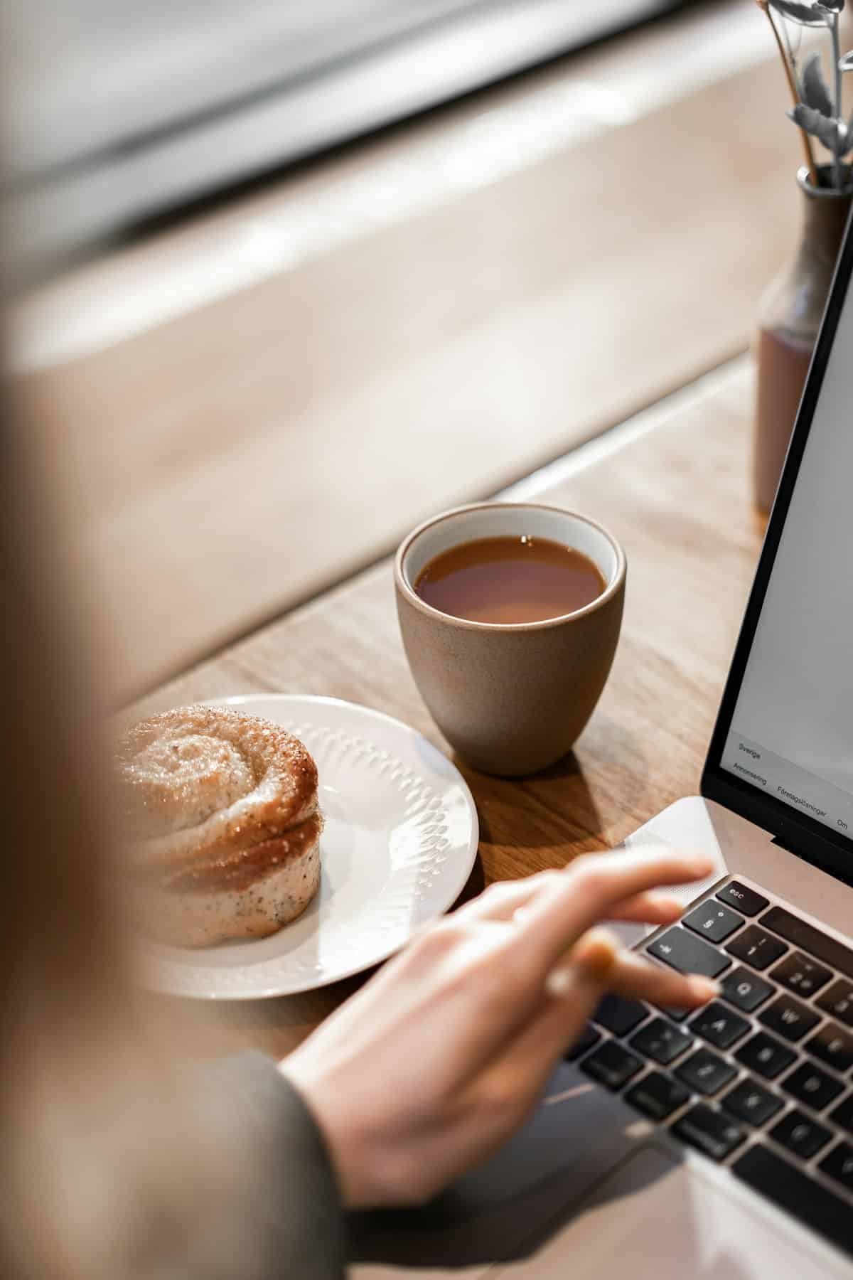 Morning desk with laptop and coffee — 6-day email walkthrough