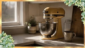 A yellow vintage KitchenAid stand mixer on a kitchen counter