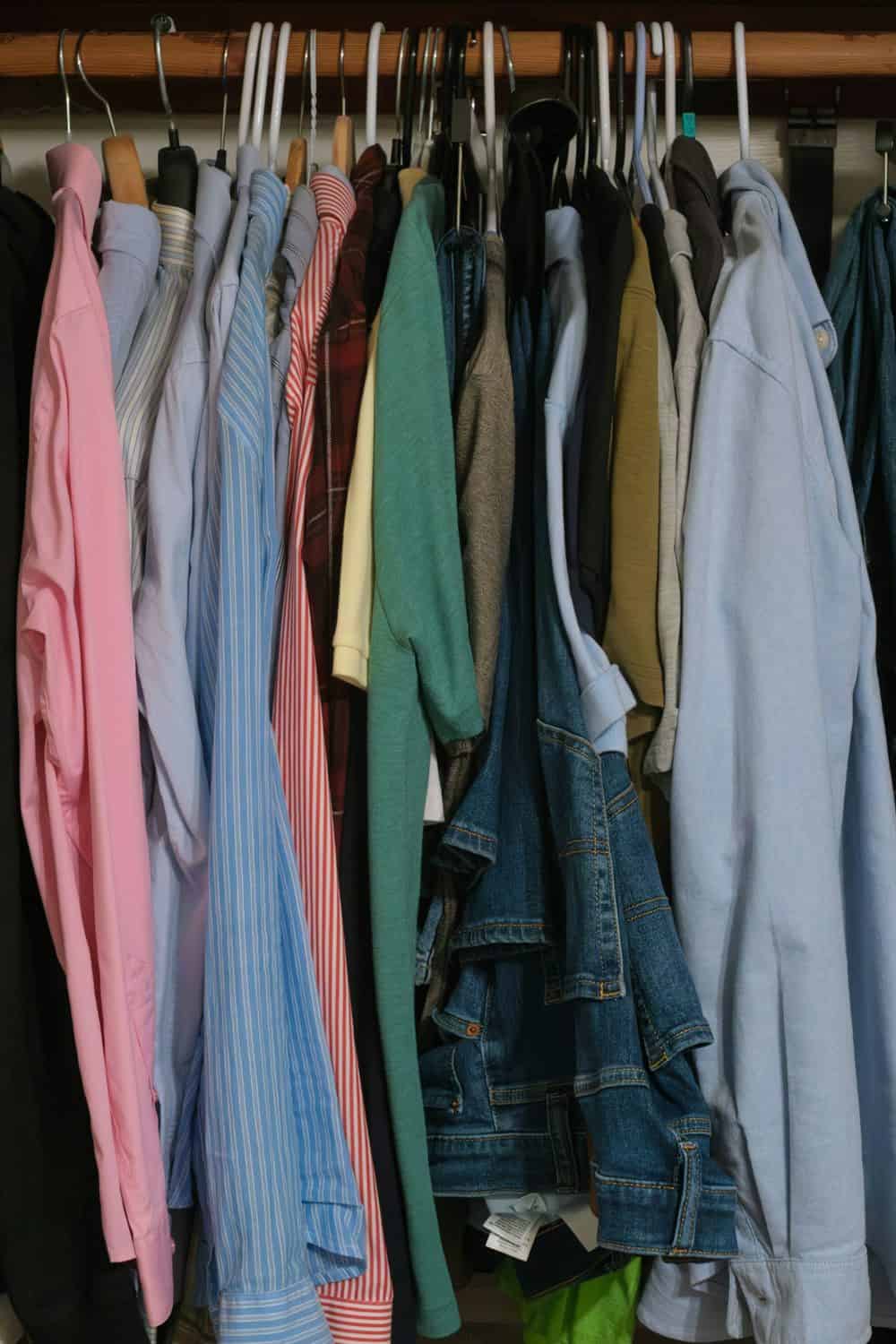 An organized closet of neatly hung clothes