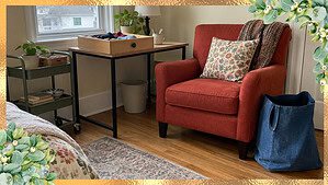 A sturdy chair set up as a seated sorting station with a drawer and donation bag, the gentle way to declutter with limited mobility