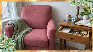 A cozy armchair corner with a side table drawer being sorted, a gentle first step for where to start decluttering